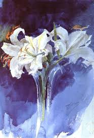 White lilies in a clear glass vase against a blue background.